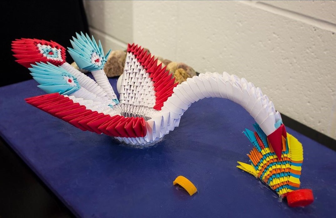 My art shows the polluted world we live in today that affects the entire animal kingdom and the world. I want to show that the animal feasts on what we humans give to them, which contains junk. The swan is seen biting the fish, who holds junk in their stomach, which will then transfer to the swan. The pollution consumed by the swan will then put her under gene transformation. After many years, the animals will start to die from eating waste that's thrown into the water.